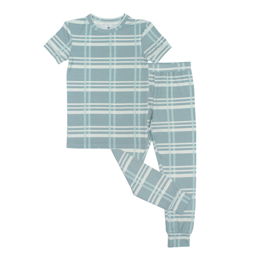 Children's blue plaid pajama set on a white background