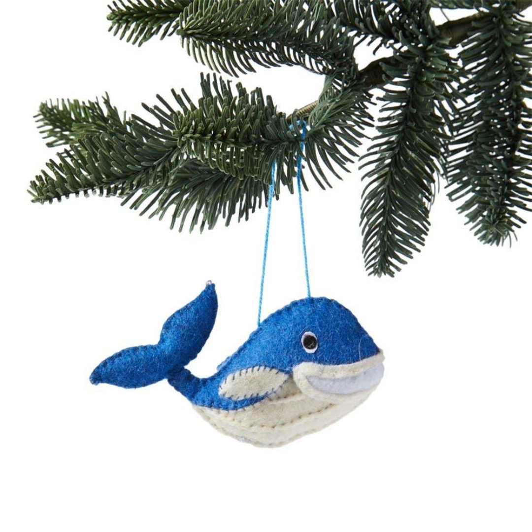 blue and white whale shaped ornament made out of felt