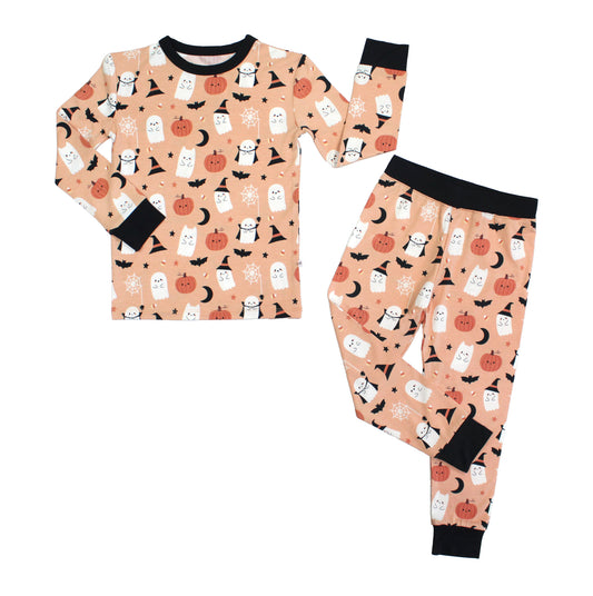 Flat lay of Boo-Tastic Halloween bamboo two-piece kids pajamas with ghost, pumpkin, bat, and witch hat print.