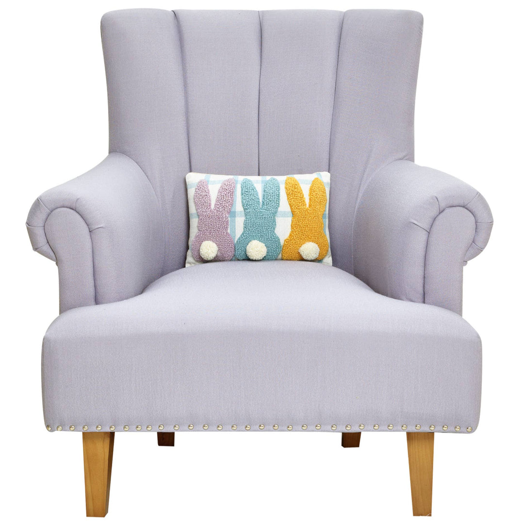 easter themed pillow displayed on a oversized chair