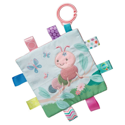 square fabric baby toy with a pink caterpillar on the front and lots of tags around the outside for babies to play with 