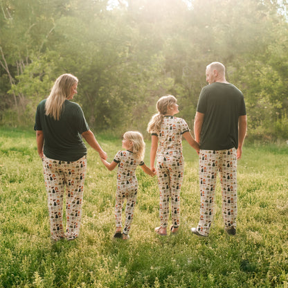 Family walking in a field wearing Camp Emerson bamboo lounge pants.