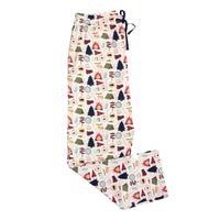 Flat lay of Camp Emerson bamboo relaxed lounge pajama pants with camping themed print of trees, tents, and campfires.