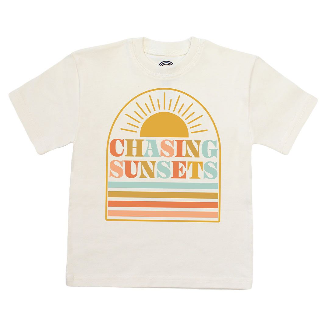 White t-shirt with 'Chasing Sunsets' graphic design on a white background