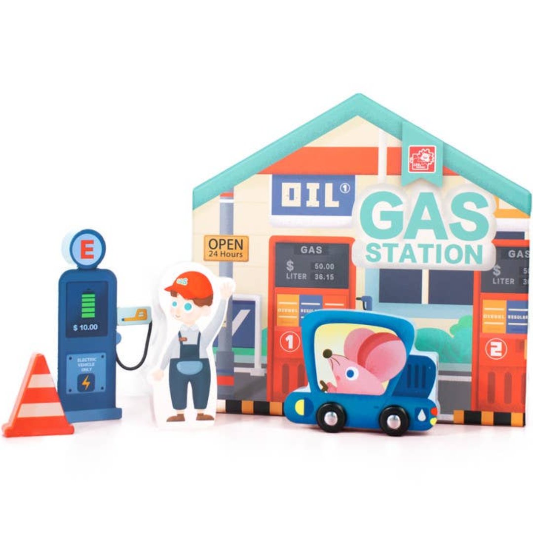 toy gas station with a little man figure pumping gas