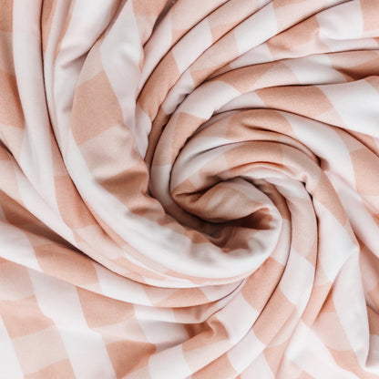 Close-up of pink and white striped fabric in a swirl pattern