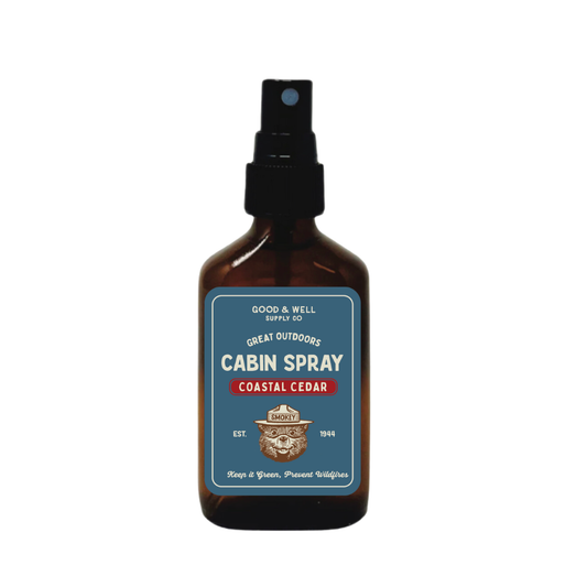 Bottle of Cabin Spray with a label on a white background