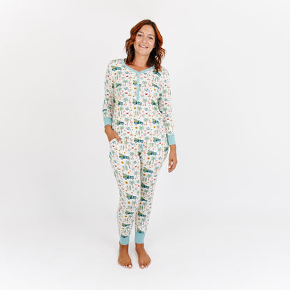Woman wearing a patterned onesie on a white background