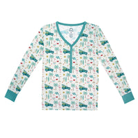 Long-sleeve shirt with tropical pattern on a white background