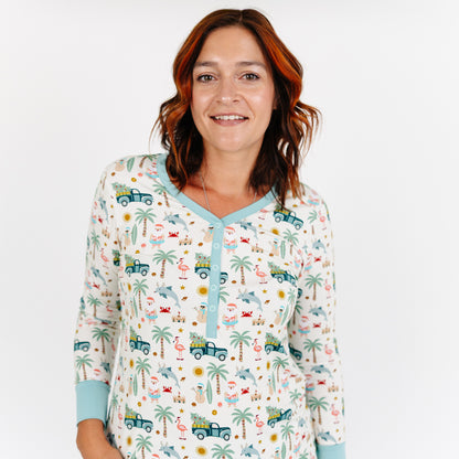 Woman wearing a patterned pajama top with a white background