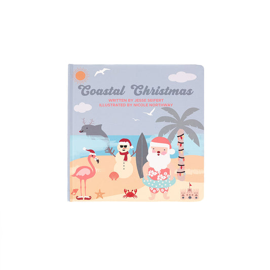 Book titled 'Coastal Christmas' with beach-themed illustrations on a white background