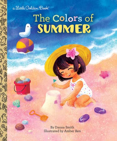 Book cover of 'The Colors of Summer' with a child in a yellow hat sitting on sand.