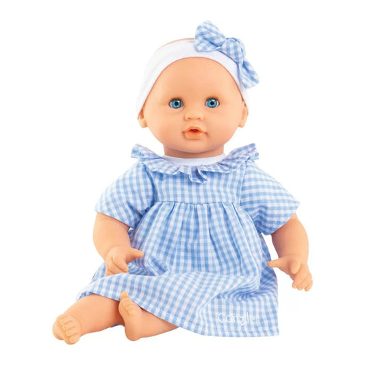 12 inch baby doll wearing a white an blue gingham dress and hair bow