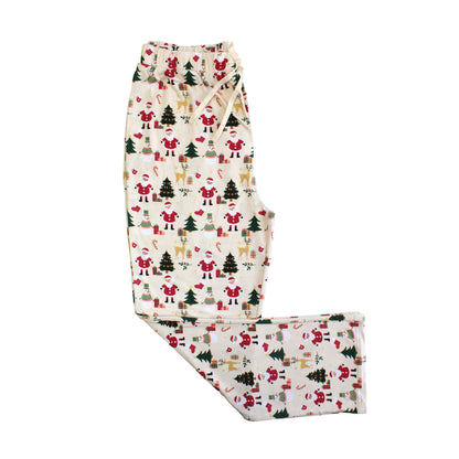 Flat lay of Cozy Christmas bamboo relaxed fit pants with drawstring waist, red cuffs, and festive holiday print.