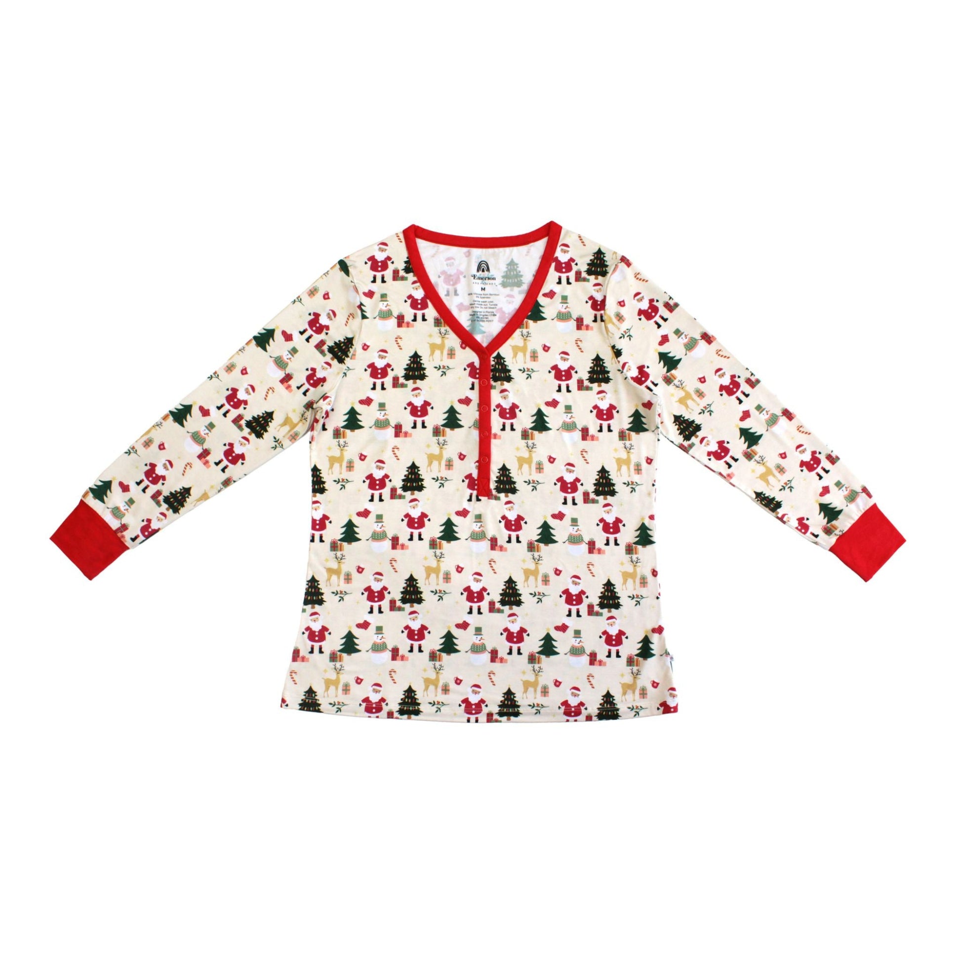 Flat lay of Cozy Christmas bamboo women’s top with red trim and festive holiday print featuring Santa, trees, and reindeer.