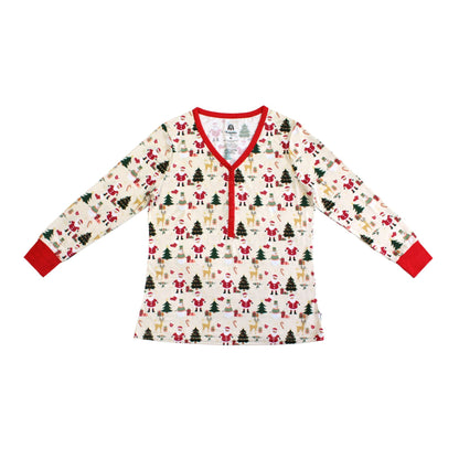 Flat lay of Cozy Christmas bamboo women’s top with red trim and festive holiday print featuring Santa, trees, and reindeer.