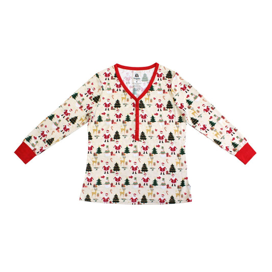 Flat lay of Cozy Christmas bamboo women’s top with red trim and festive holiday print featuring Santa, trees, and reindeer.