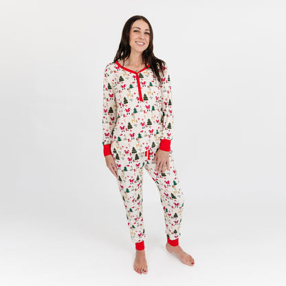 Woman stands wearing Cozy Christmas bamboo top and matching pajama pants, highlighting soft fabric and festive print.