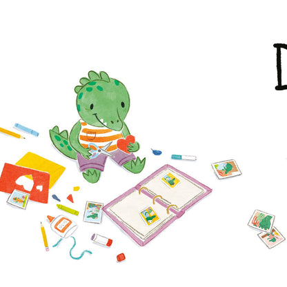 Children's book titled 'Dear Dad' with a green dinosaur character and stationery items on a white background.