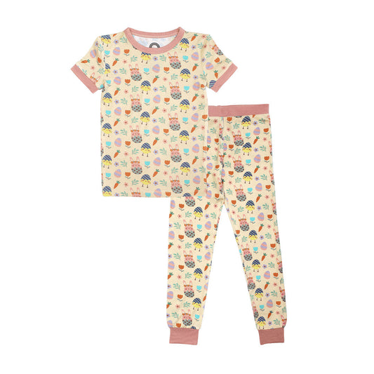 the "egg hunt" matching pajama set. the "egg hunt" print is a easter theme. the colors are pastel. you can find flowers, carrots, easter bunnies in easter eggs, and chicks who have half an easter egg on their head. 