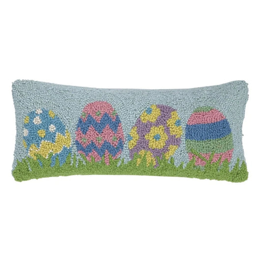 Multi-colored Easter eggs on a long pillow
