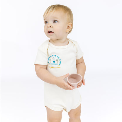 Baby wearing a white bodysuit with a blue graphic and text on a white background