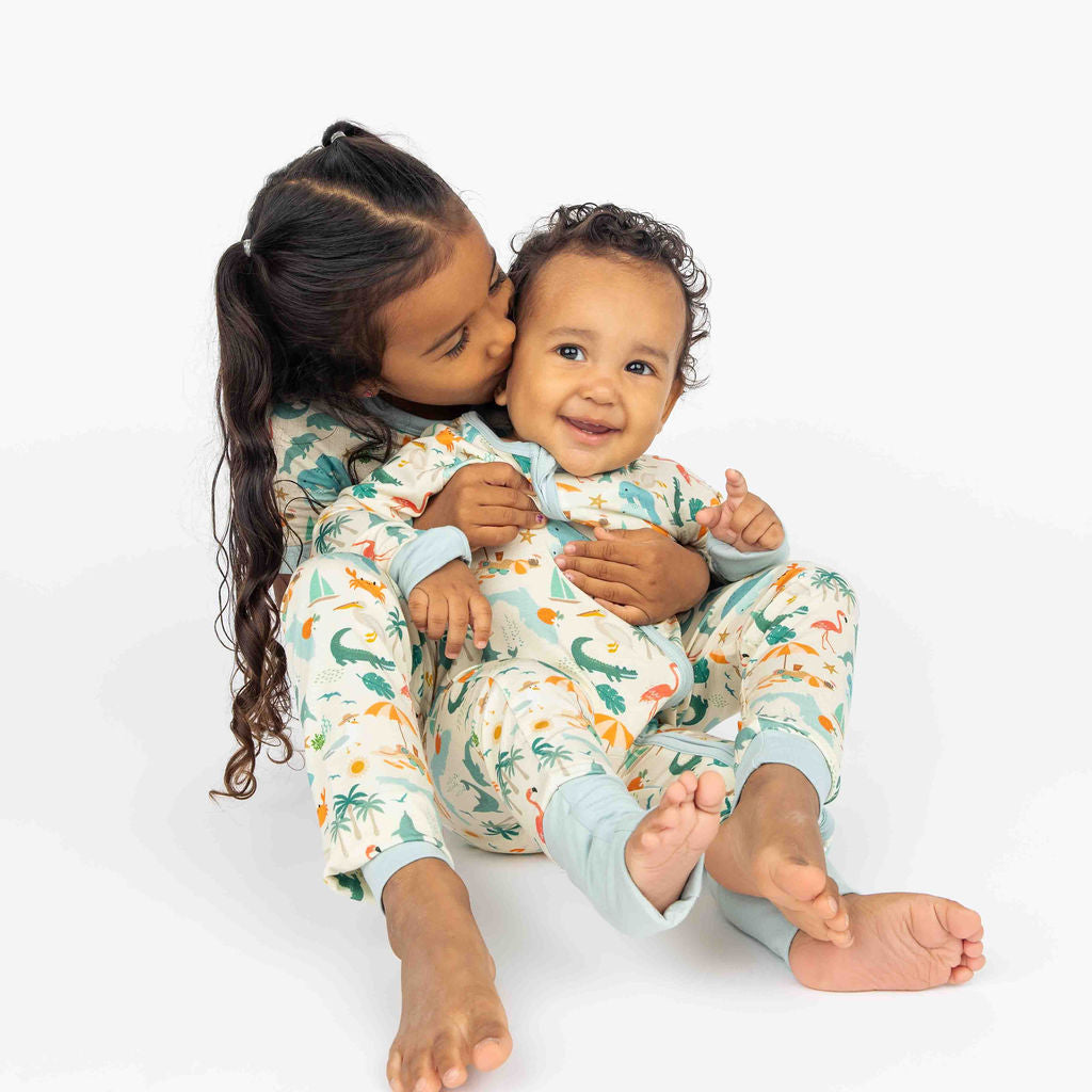 Soft and breathable bamboo convertible pajama featuring a vibrant Florida-themed print with foldable hand and feet covers for babies and toddlers.