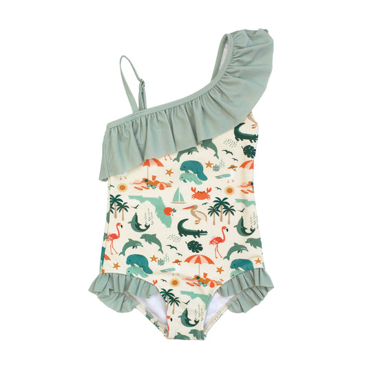Girls one-shoulder ruffle swimsuit in the Explore Florida print with sage green ruffle trim and a pattern of flamingos and palm trees.