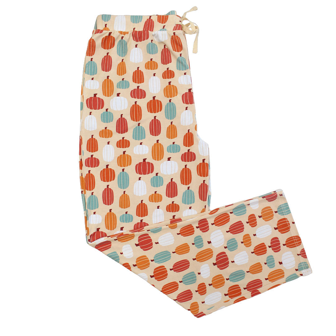 the "pumpkin patch"relaxed pants. the 'pumpkin patch" print is a mix of boho styled and colored pumpkins. you can see white, blue, orange, and red pumpkins in.different shapes and sizes. this is all on a pastel orange background. 