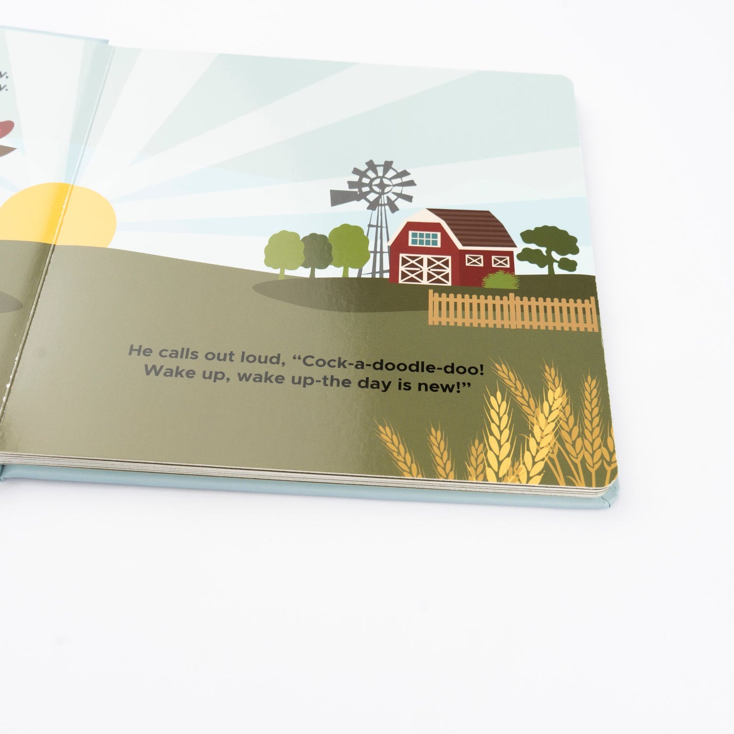 Illustrated book page with a farm scene, windmill, and text.