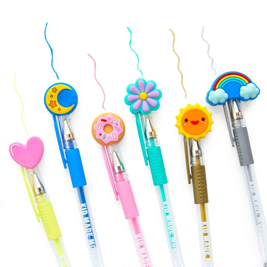 rainbow pens with fun shapes on the caps including a donut, heart, flower, moon, sun, and rainbow