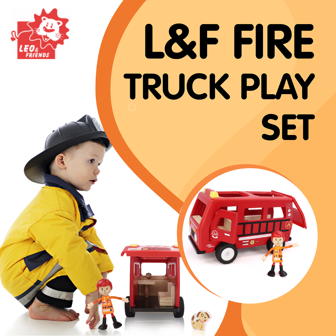 little boy playing with a red wooden fire truck toy with a little wooden man and dog included