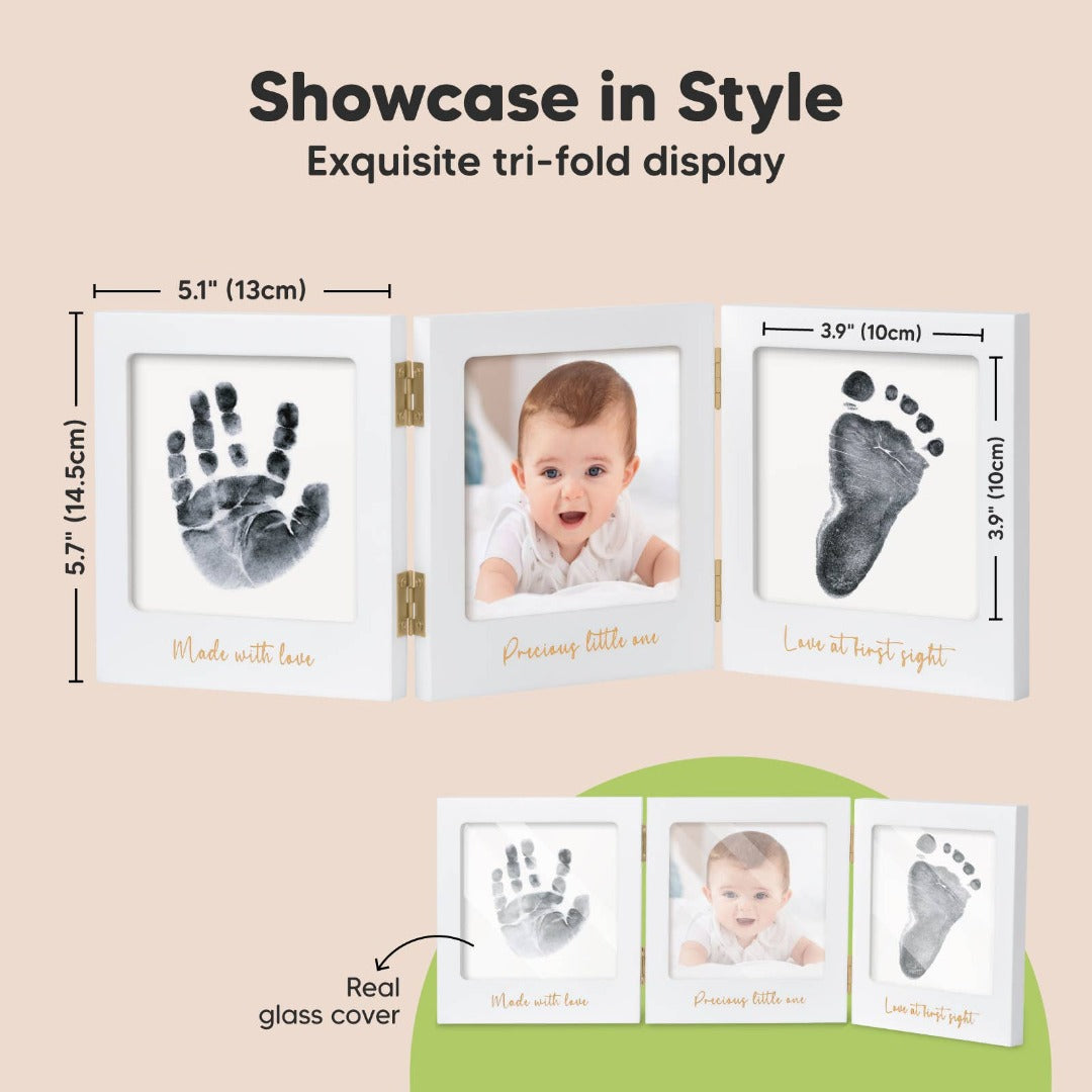 Ad for a white picture frame showing inked baby hand and footprints and a picture of a baby