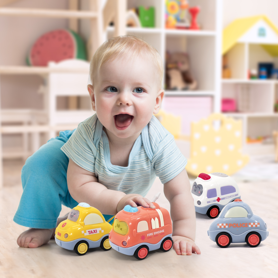 baby playing with a set of 4 toy vehicles