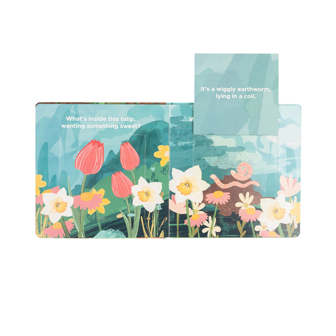 an excerpt from the "Garden Friends" lift-a-flip board book. - what's inside this tulip, wanting something sweet? it's a wiggly earthworm, lying in a coil. 