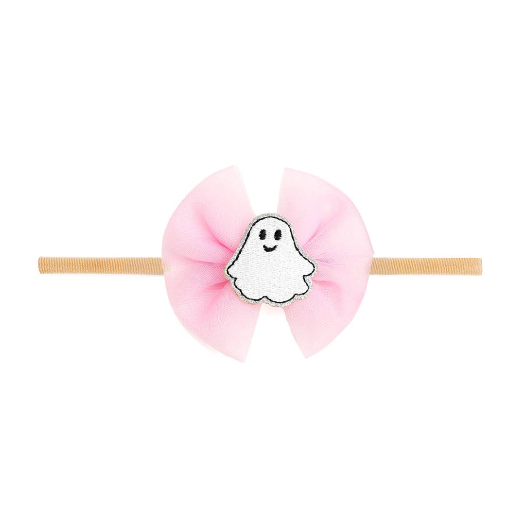 baby headband with a pink bow and a ghost attached