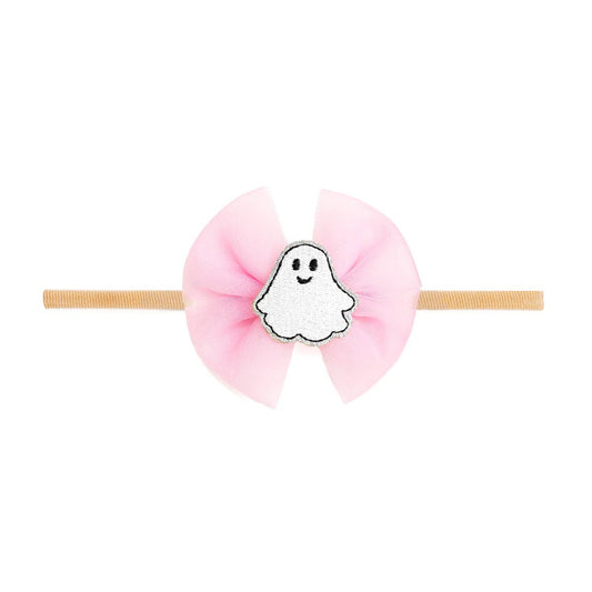 baby headband with a pink bow and a ghost attached