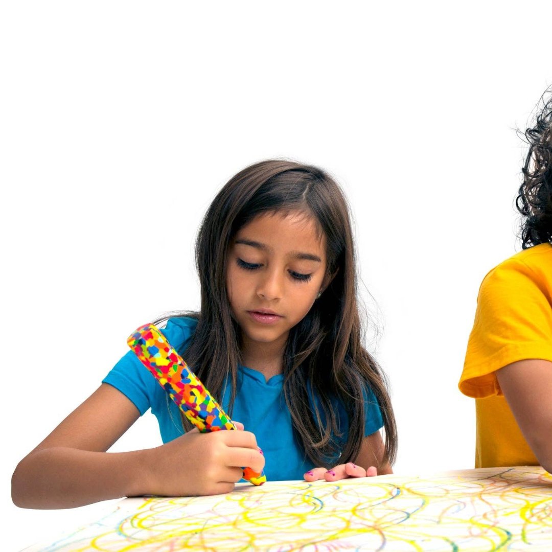 giant multi colored crayon being used by a little girl