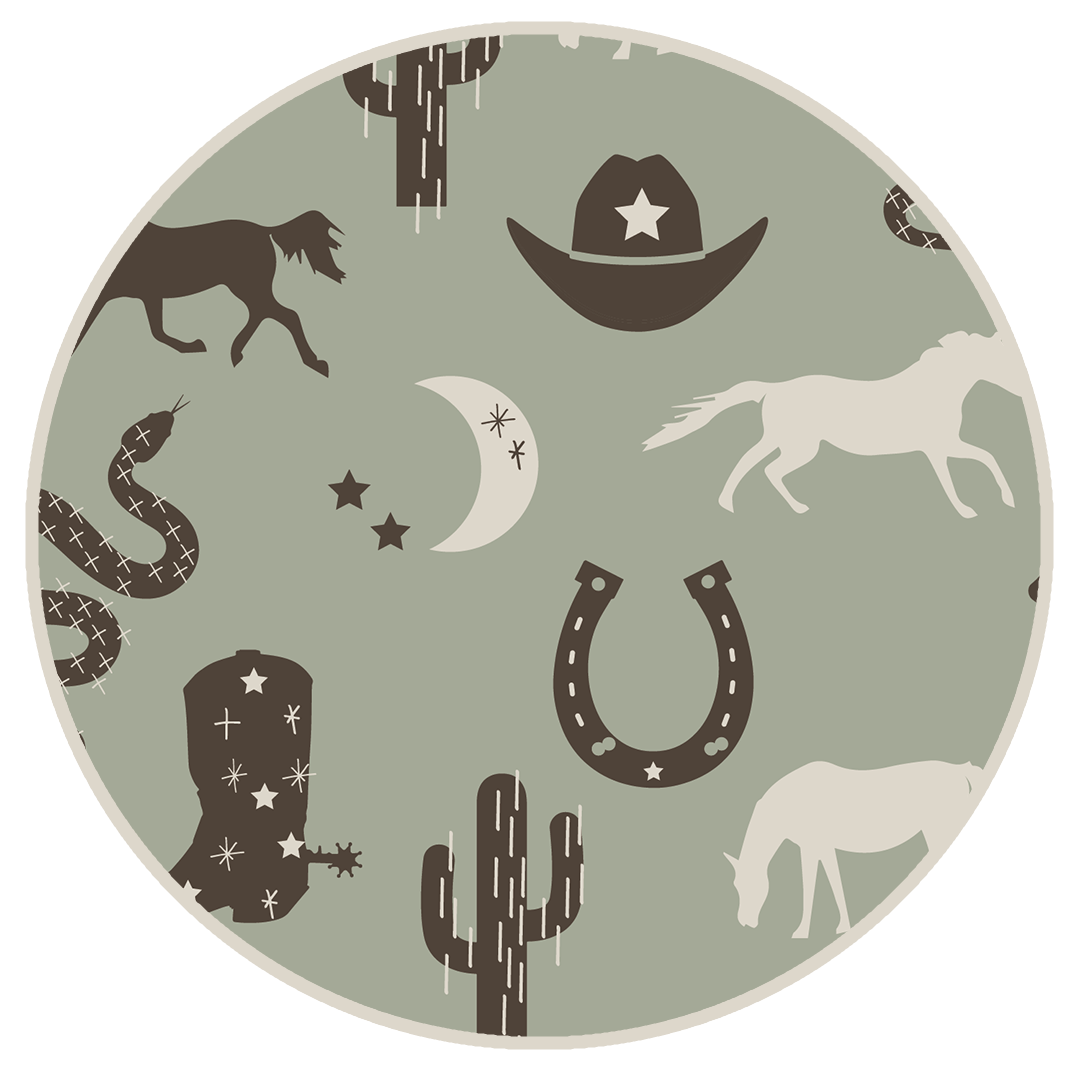 the "giddy up" print is a western look at horses, cowboy hats, boots, horse rings, cacti, moons and stars. colors on this print include green, brown, and white. 