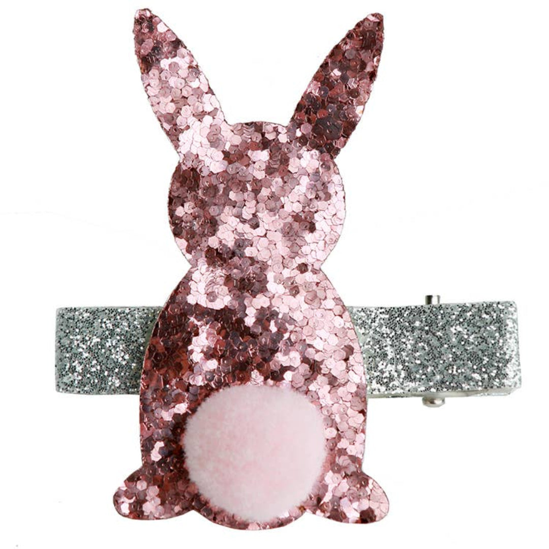 Silver glitter hair clip with a pink glitter bunny on the front and a fuzzy pom pom tail