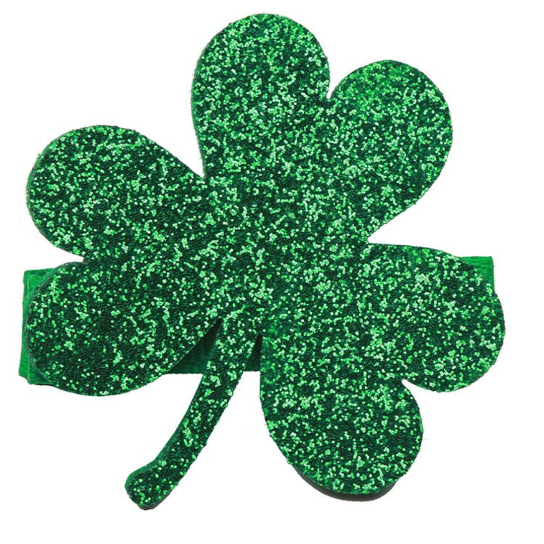 shamrock shaped hair clip thats covered in green glitter