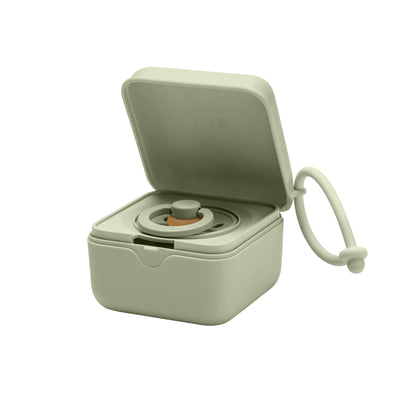 Small beige container with a lid on a white background