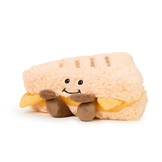 Plush toy shaped like a hot dog with a smiling face on a white background