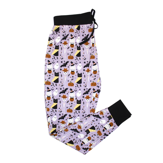 the "spooky cute purple" jogger pajama pants. the "spooky cute purple" print is a halloween themed pattern that contains cute versions go ghost, skeletons, black cats, candy treats, bats, and pumpkins. 