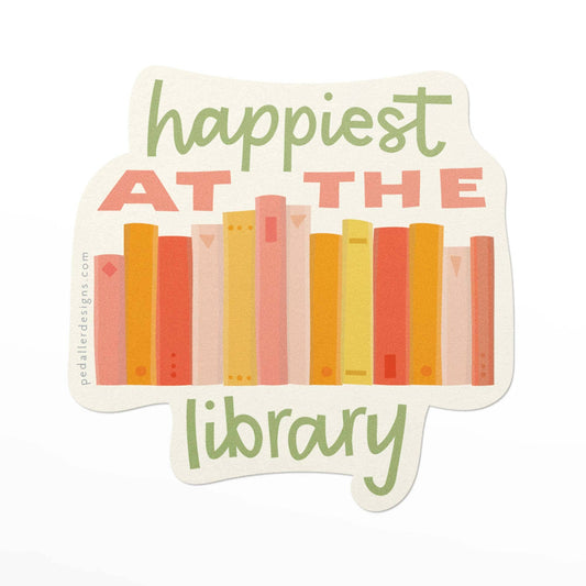 sticker that reads happiest at the library and has books on it