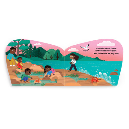 Illustrated children's book open to a page with children playing by a lake.