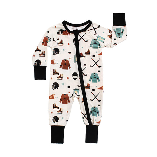 Baby onesie with hockey-themed pattern on a white background