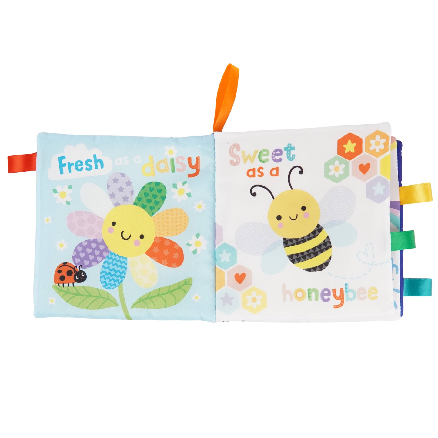 Two colorful soft books with a flower and bee design on a white background