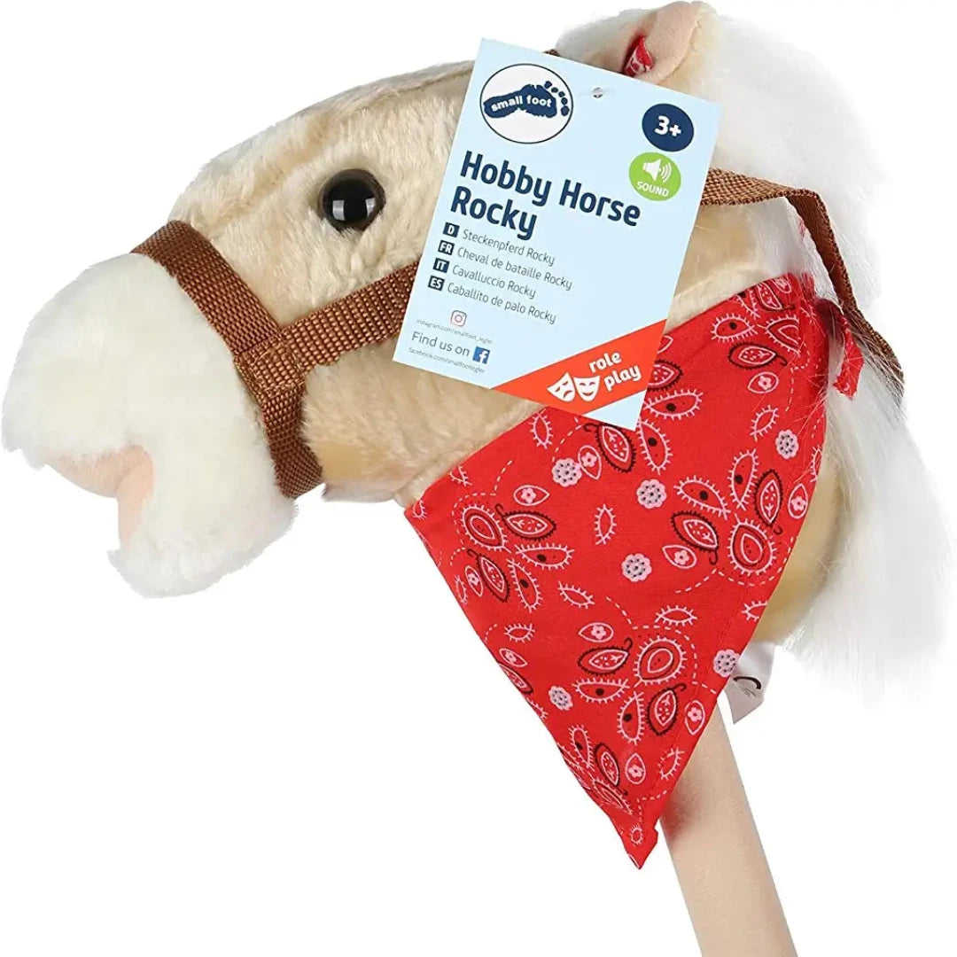 tan colored hobby horse with a red bandana