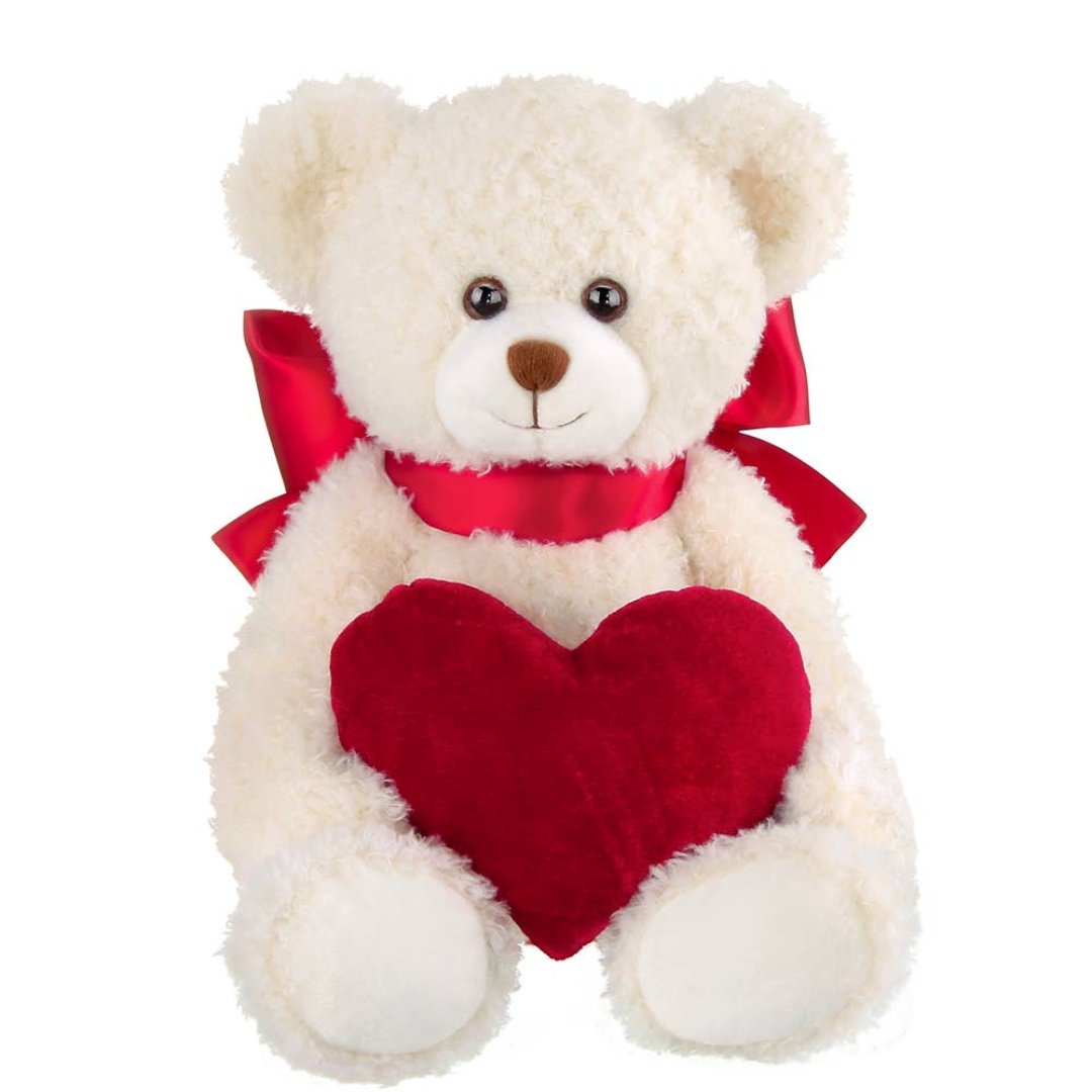 white teddy bear holding a red heart